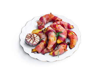 Baked pumpkin slices wrapped in bacon in frying pan isolated on white