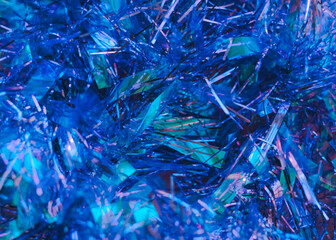 Abstract shiny background Photo for posters and banners Blue tinsel with glitter effect in close up