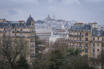 Fototapeta na wymiar Paris, France - 12 12 2020: View of the Sacred Heart in Montmartre district from the Temple of the Sibyl