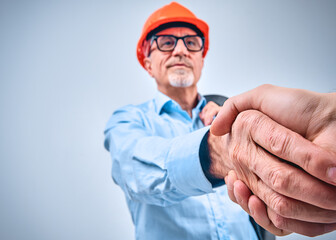 Contractor and architect welcoming each other to a meeting