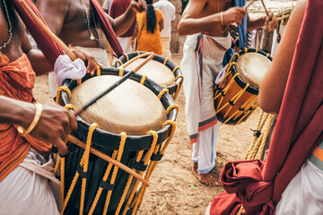 Fototapeta na wymiar Indian men play traditional percussion drum Chenda in Kerala, India