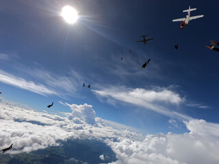 Skydivers jumping out of two airplanes 