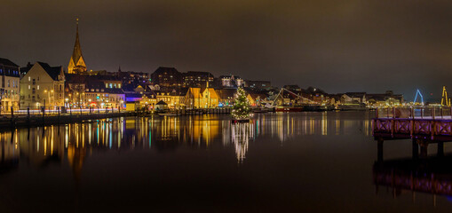 Panorama view of  of festive lighting and Christmas romantic atmosphere in the Flensburg at night....
