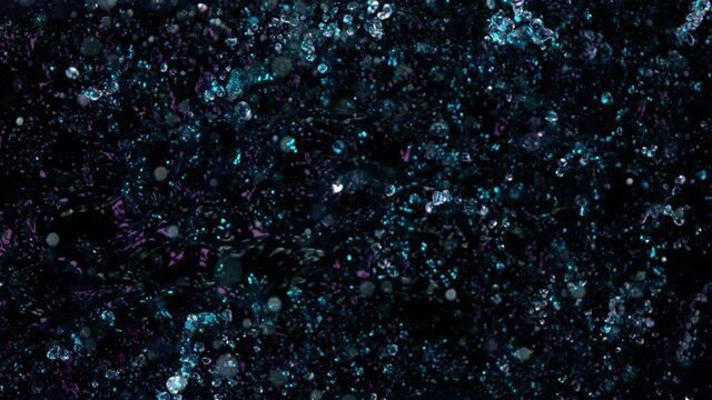 Water splashing on black background, super slow motion. Filmed on high speed cinema camera, 1000 fps.