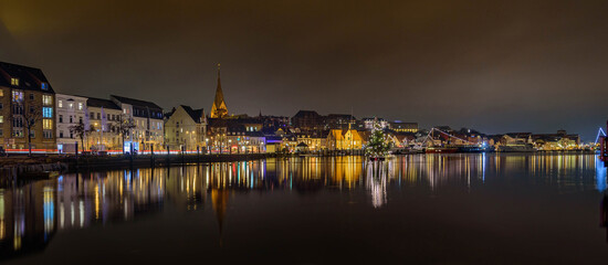  Panorama view of of festive lighting and Christmas romantic atmosphere in the Flensburg at night....