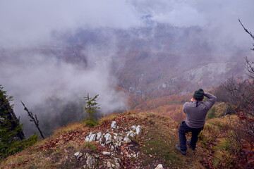 Professional nature photographer in the mountains