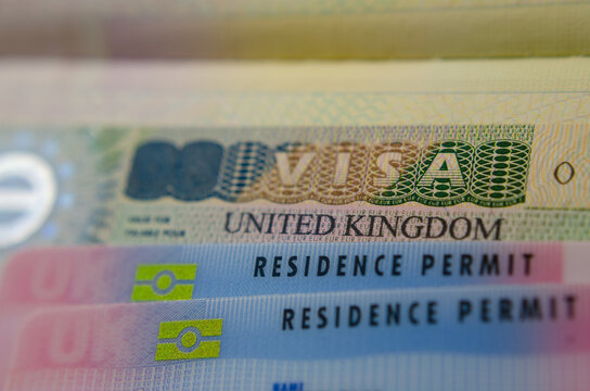 United Kingdom BRP (Biometrical Residence Permit) cards for Tier 2 work visa  placed on top of UK VISA sticker in the passport. Close up photo. Stock  Photo | Adobe Stock