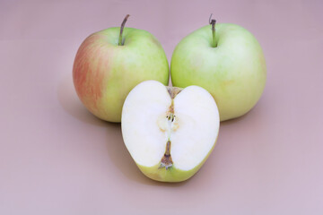 A few apples on yellow background, benefits of apples concept