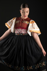 Young beautiful slovak woman in traditional dress. Slovak folklore