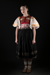 Young beautiful slovak woman in traditional dress. Slovak folklore