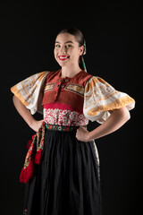 Young beautiful slovak woman in traditional dress. Slovak folklore