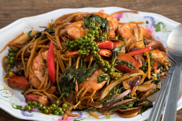Spicy Thai Drunken Noodles with Shrimps named Pad Kee Mao Goong