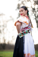Young beautiful slovak woman in traditional dress. Slovak folklore