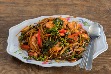 Spicy Thai Drunken Noodles with Shrimps named Pad Kee Mao Goong