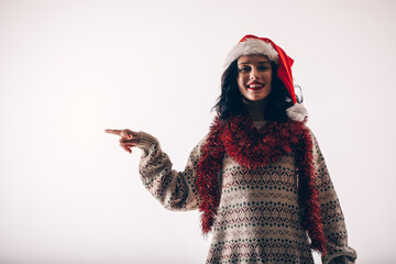 Woman in Christmas dress shows the finger. 