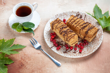front view yummy cake slice with tea and berries on light background biscuits cake sweet