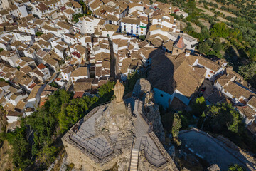 Aerial view of Castle of Castril de la Peña (Granada) and Jesus Christ monument above the Castril...