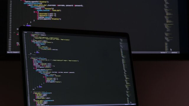 Real Javascript code. Front end web development. Java script JS code on laptop screen. Web design concept.