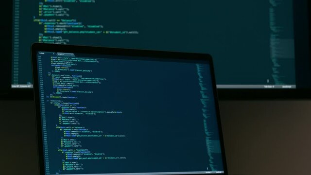 Real Javascript code. Front end web development. Java script JS code on laptop screen. Web design concept.