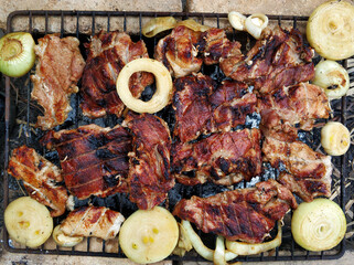 Smoky barbecue on the grill outside. The meaty taste of spring