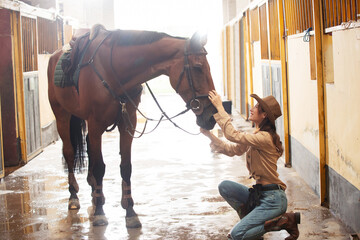 The stable of young women and horses