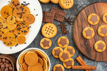 close up view of different sorts of desserts on grey background