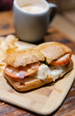 Ciabatta Bread Sandwich with Turkey Pesto and chips.