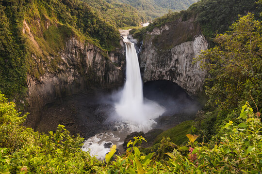Waterfall falling into a round lake