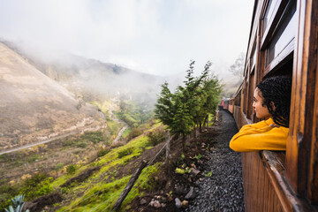 Girl looking out the window on the train