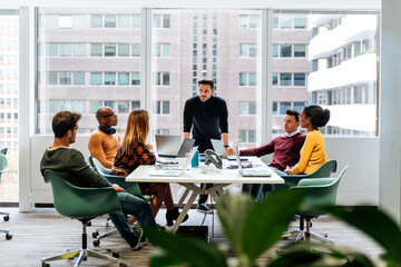 Coworkers having meeting in conference room