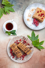 top view yummy cake slice with tea and berries on light background biscuit cake sweet