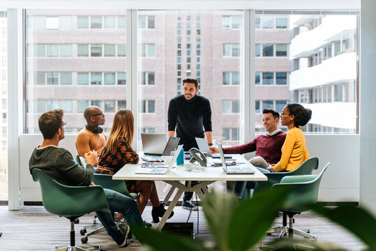 Coworkers having meeting in conference room