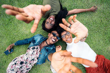 Three afro women lying down