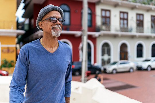 Senior Black Man Walking Down The Street.