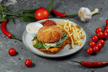 Fresh and fried fish burger with vegetables