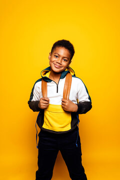 Black boy in studio smiling.