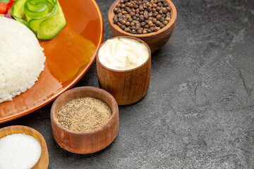 Half shot of Healthy diet with some flavors in horizontal view