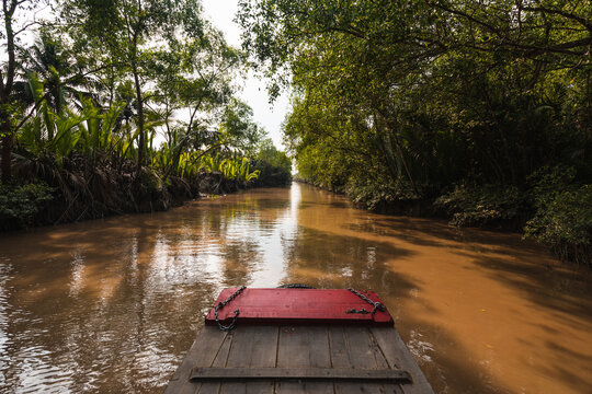 Wooden plank that serves as a boat on the river