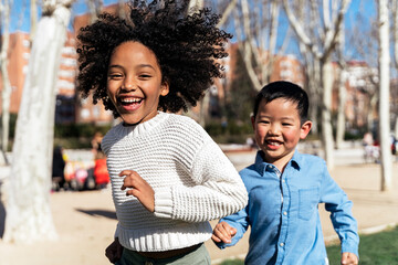 Multiethnic children playing at the park.
