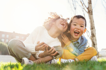 Afro and asian children laughing.