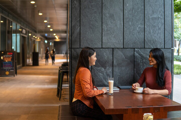 Two asian business woman