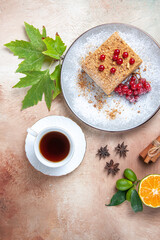 top view cake slice with tea and red berries on light background cake biscuit sweet