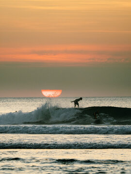 Surfing on the beach