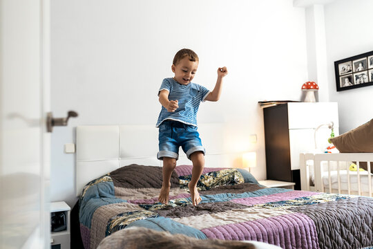 Boy having fun on bed
