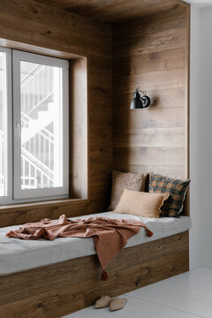 Cozy window seat in wooden interior
