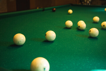 game of billiards on a green cloth