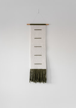 Woven decoration on blank white wall