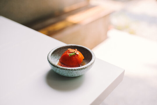 Japanese Food Style Pickled Tomatoes in soya soup on table