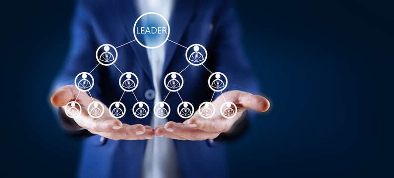 Businessman holding Leader in screen