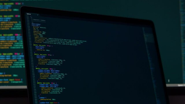 Real CSS code. Front end web development. CSS code on laptop screen. Web design concept.